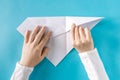 Person`s hands folding a paper airplane Royalty Free Stock Photo