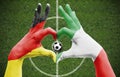 Person`s hands forming a heart with the flags of Germany and Italy - love towards football concept