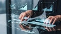 Person interacting with holographic financial data charts and graphs on a futuristic interface Royalty Free Stock Photo