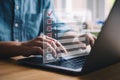 Person\'s hands typing code on a laptop with digital overlay Royalty Free Stock Photo