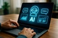Person\'s hands typing on a laptop displaying AI chatbot interface with data charts artificial intelligence Royalty Free Stock Photo