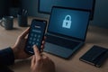 Person\'s Hands Unlocking Smartphone with Laptop Displaying Padlock Icon password Royalty Free Stock Photo