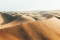 Person on sand dune in desert sunset of Huacachina, Ica, Peru, South America Royalty Free Stock Photo