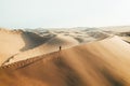 Person on sand dune in desert sunset of Huacachina, Ica, Peru, South America Royalty Free Stock Photo