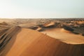 Person on sand dune in desert sunset of Huacachina, Ica, Peru, South America Royalty Free Stock Photo