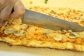 Person Cutting Pizza Slice With Knife Royalty Free Stock Photo