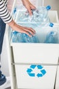 Person segregating plastic bottles Royalty Free Stock Photo