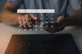 Person selecting date on digital calendar interface via mobile device, representing time management, task scheduling, productivity Royalty Free Stock Photo