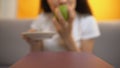 Person serves apple to starving girl, strict veganism and lack of vitamins, diet