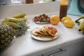 A person serving sweet pancakes with fresh fruits Royalty Free Stock Photo