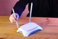 Person setting internet router antennas on wooden table