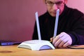 Person setting router antenna on table