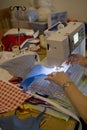 Person on sewing machine making bunting