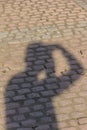 Person shadow on brick floor texture