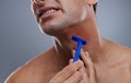 Person, shaving and beard or razor burn for hair removal or red rash, inflammation or grey background. Hand, tool and Royalty Free Stock Photo