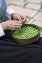 Person shelling green beans