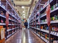 Person shopping for beer and liquor inside a Total Wine and More beverage shop in downtown Bellevue