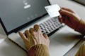 Person shopping making Payment at Computer using Credit Card Royalty Free Stock Photo