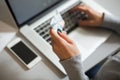 Person shopping making Payment at Computer using Credit Card Royalty Free Stock Photo