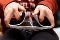 A person shuffling a deck of playing cards with a good color contrast between red and black colors Royalty Free Stock Photo