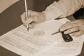 Person signing a document on the sale of the machine