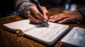 person signing a document, person writing on a notebook, close-up of bussinessman hand writing on a notebook with pen Royalty Free Stock Photo