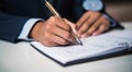 person signing a document, person writing on a notebook, close-up of bussinessman hand writing on a notebook with pen Royalty Free Stock Photo