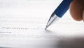 Person Signing Important Document. Camera Following Tip of the Pen as it Signs Crucial Business Co Royalty Free Stock Photo