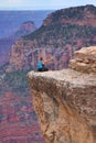 Person taking dangerous selfie in Grand Canyon, Arizona, USA Royalty Free Stock Photo