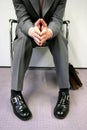 Person sitting impatiently Royalty Free Stock Photo