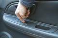 a person sitting inside the car and open the window, finger push the button Royalty Free Stock Photo