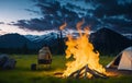 person sitting near camping tent in a mountains next to a bonfire in relaxing nature