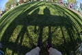 Person sitting at park bench with shadows