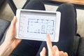 Person sketching home design architecture project on digital tablet, blueprint Royalty Free Stock Photo