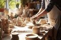 Person Crafting Pottery on Table, Creating Handmade Ceramic Artwork