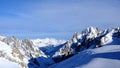 a person on skis skiing on a snowy mountain side