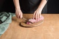 A person slicing pork tenderloin for making a meal Royalty Free Stock Photo