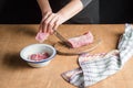 A person slicing pork tenderloin for making a meal Royalty Free Stock Photo