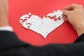 Person Solving Heartshape Jigsaw Puzzle Royalty Free Stock Photo