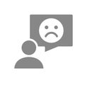 Person with speech bubble and sad face gray icon. Feedback, negative comment symbol. Royalty Free Stock Photo