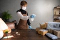 A person spraying disinfectant on parcels and boxes during coronavirus Covid-19 pandemic
