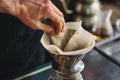 person spreading a cloth filter onto a pourover stand Royalty Free Stock Photo