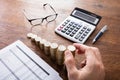 Person Stacking Coins On Desk Royalty Free Stock Photo