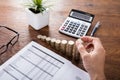 Person Stacking Coins On Desk Royalty Free Stock Photo