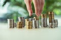 Person stacking coins on table, investment concept Royalty Free Stock Photo