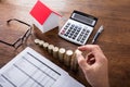 Person Stacking Coins On Wooden Desk Royalty Free Stock Photo