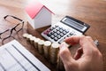 Person Stacking Coins On Wooden Desk Royalty Free Stock Photo