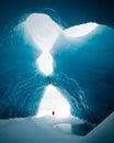 Person Is Standing In Beautiful Ice Cave In VatnajÃ¶kull Glacier Iceland In The Winter
