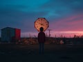 a person standing in front of a large clock Royalty Free Stock Photo