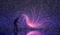 a person standing in front of a large display of fireworks generated